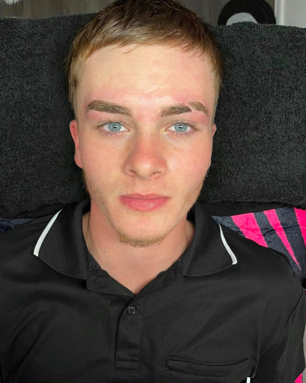 Freshly mapped, waxed and tinted brows on a male client, with a shaved slit through one brow