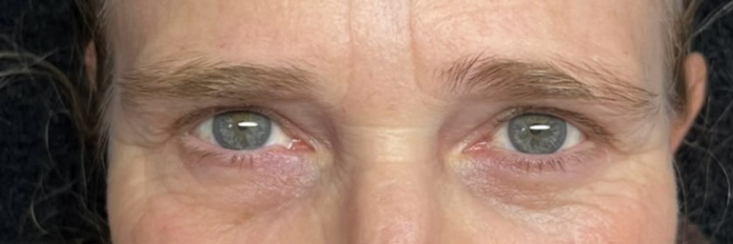 Straight, flat natural lashes and pale brows before a lash lift