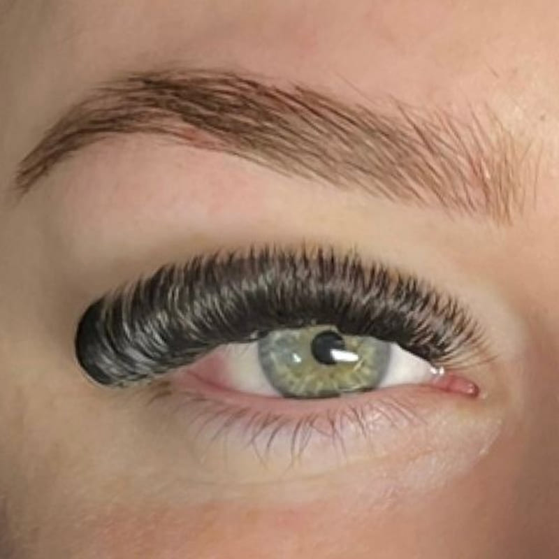 Macro close-up of a 10D volume lash set and a laminated brow