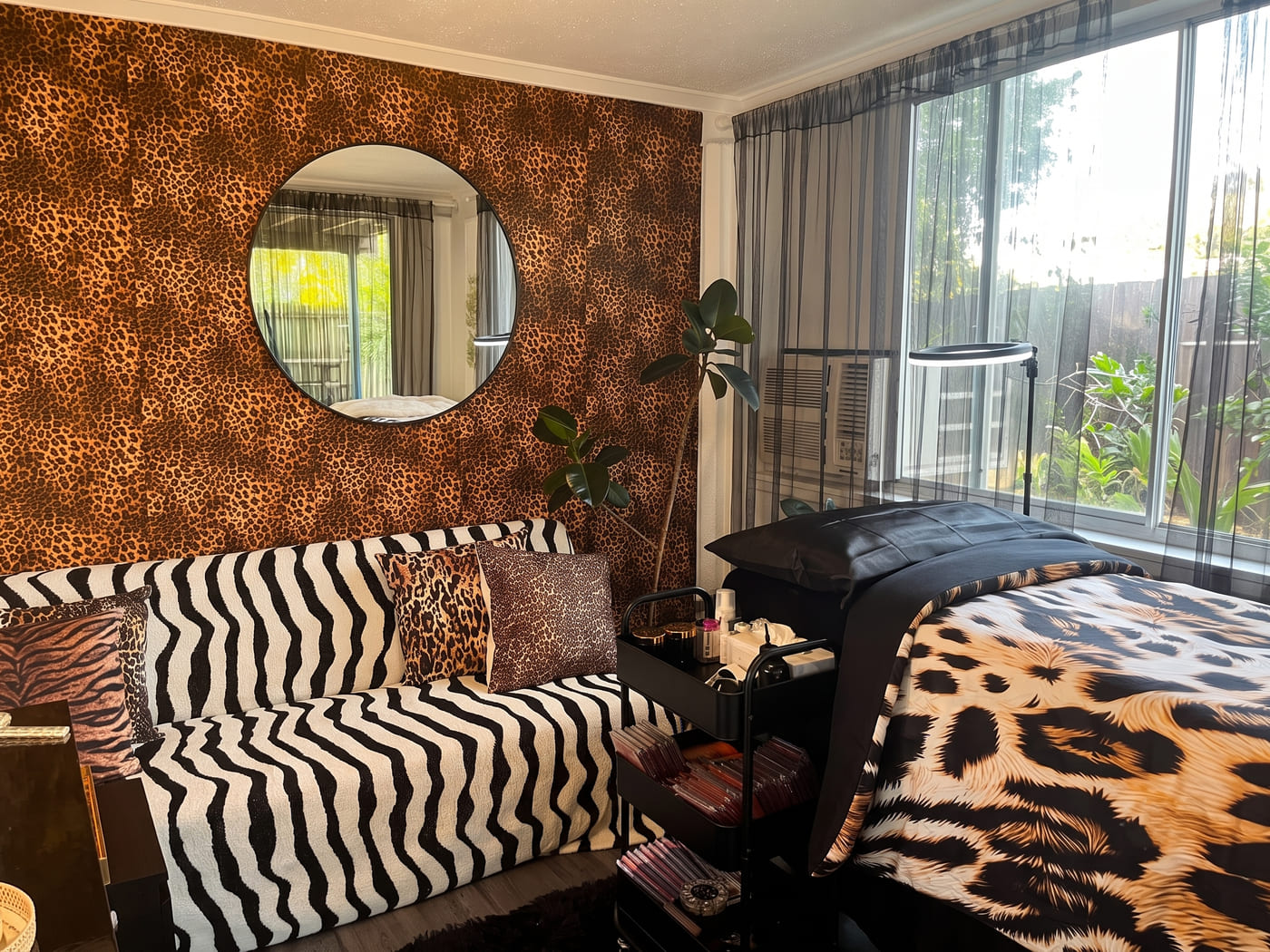 The Beauty by Gaia studio in Redcliffe — leopard-print wall, zebra couch and the treatment bed